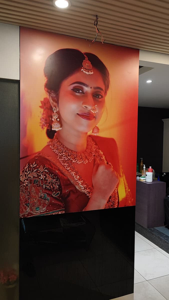 Floor-to-ceiling bridal portrait vinyl wall wrap inside a salon