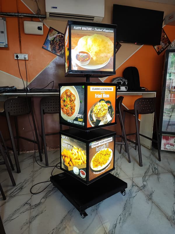 3-tier rotary food display standee inside a restaurant