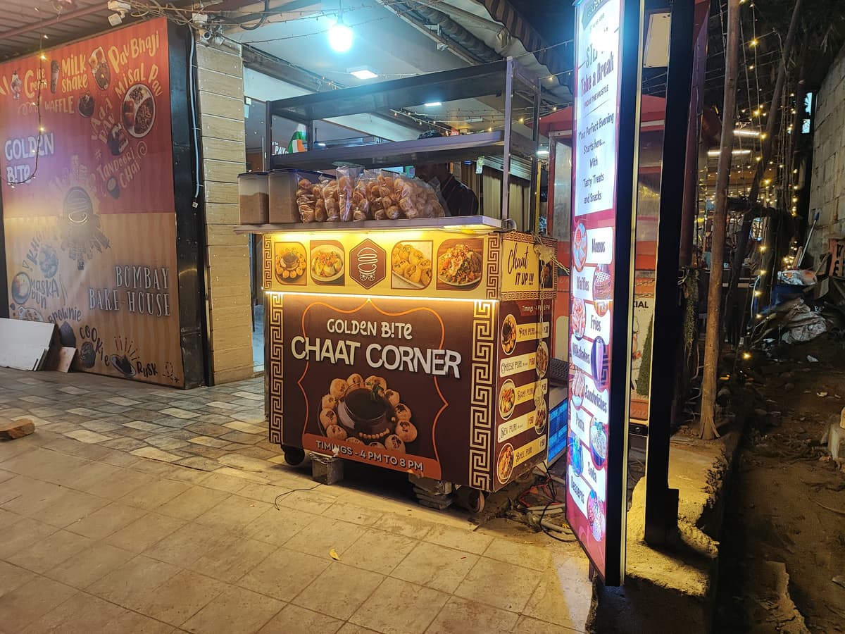 Golden Bite Chaat Corner branded street food stall at night