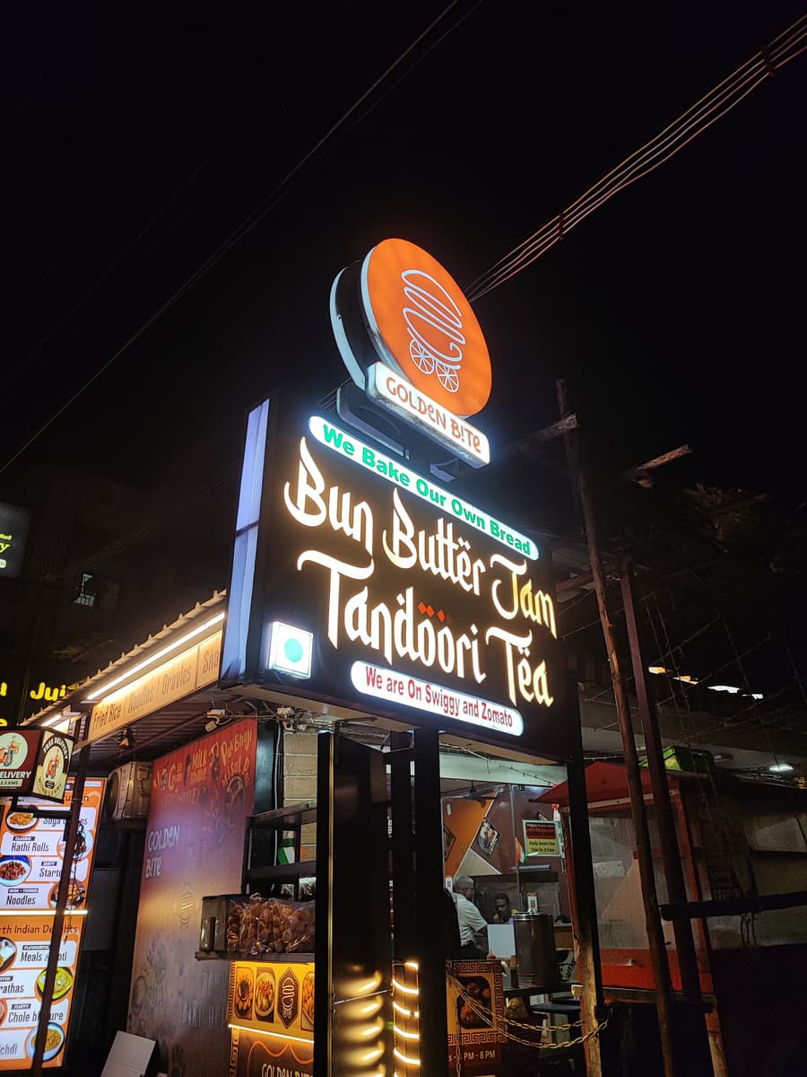 Bun Butter Jam Tandoori Tea glow signboard lit up at night