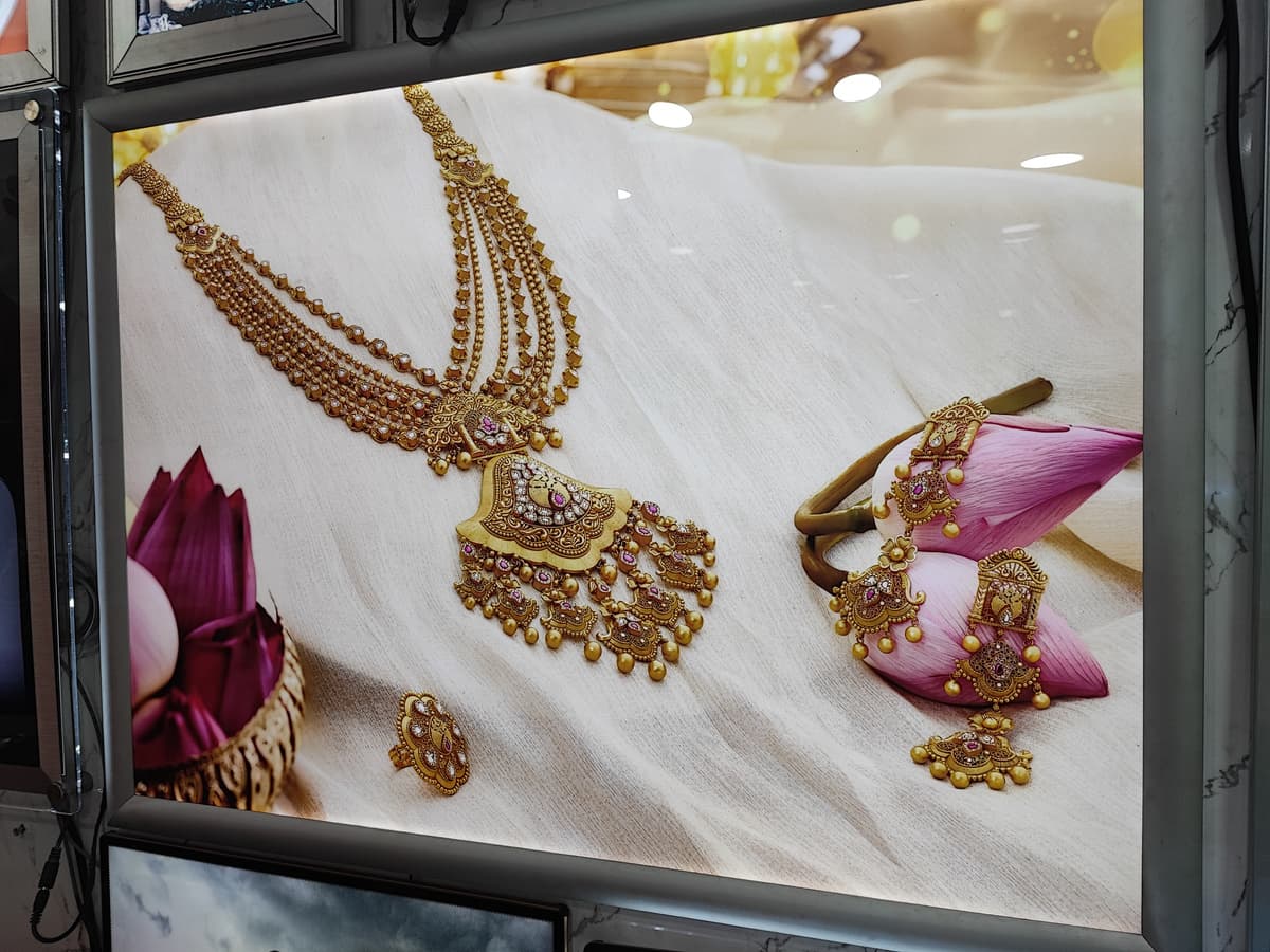Gold jewellery LED display panel inside a showroom