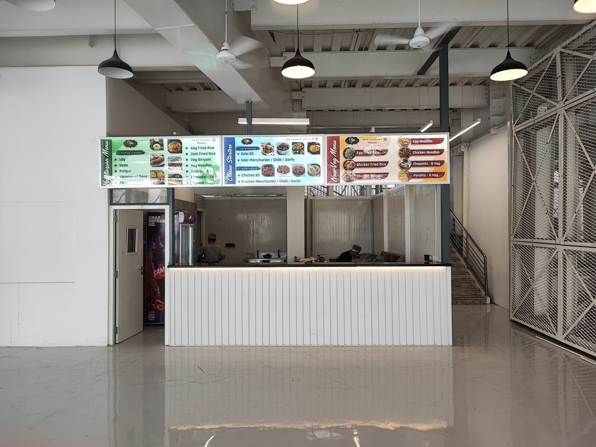 Long menu signage spanning veg, classic and non-veg counters