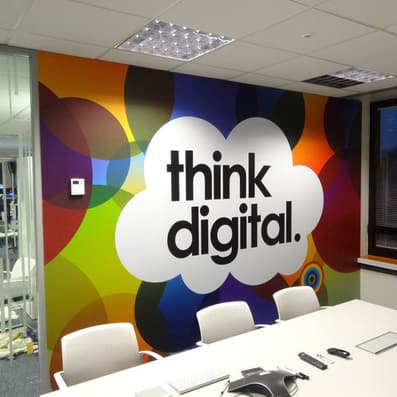 Think Digital conference room wall with colourful vinyl decal